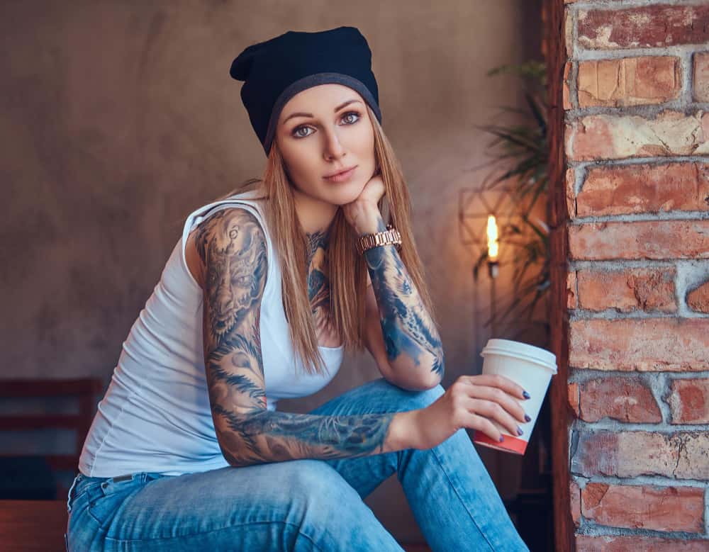 tattoed sexy blonde t shirt hat with cup coffee room with loft interior min